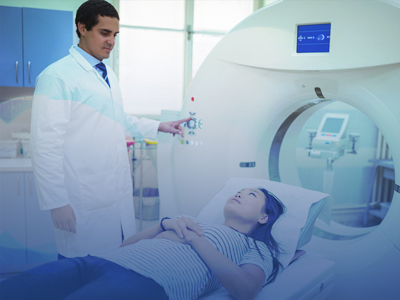 tech using mri machine with latina patient